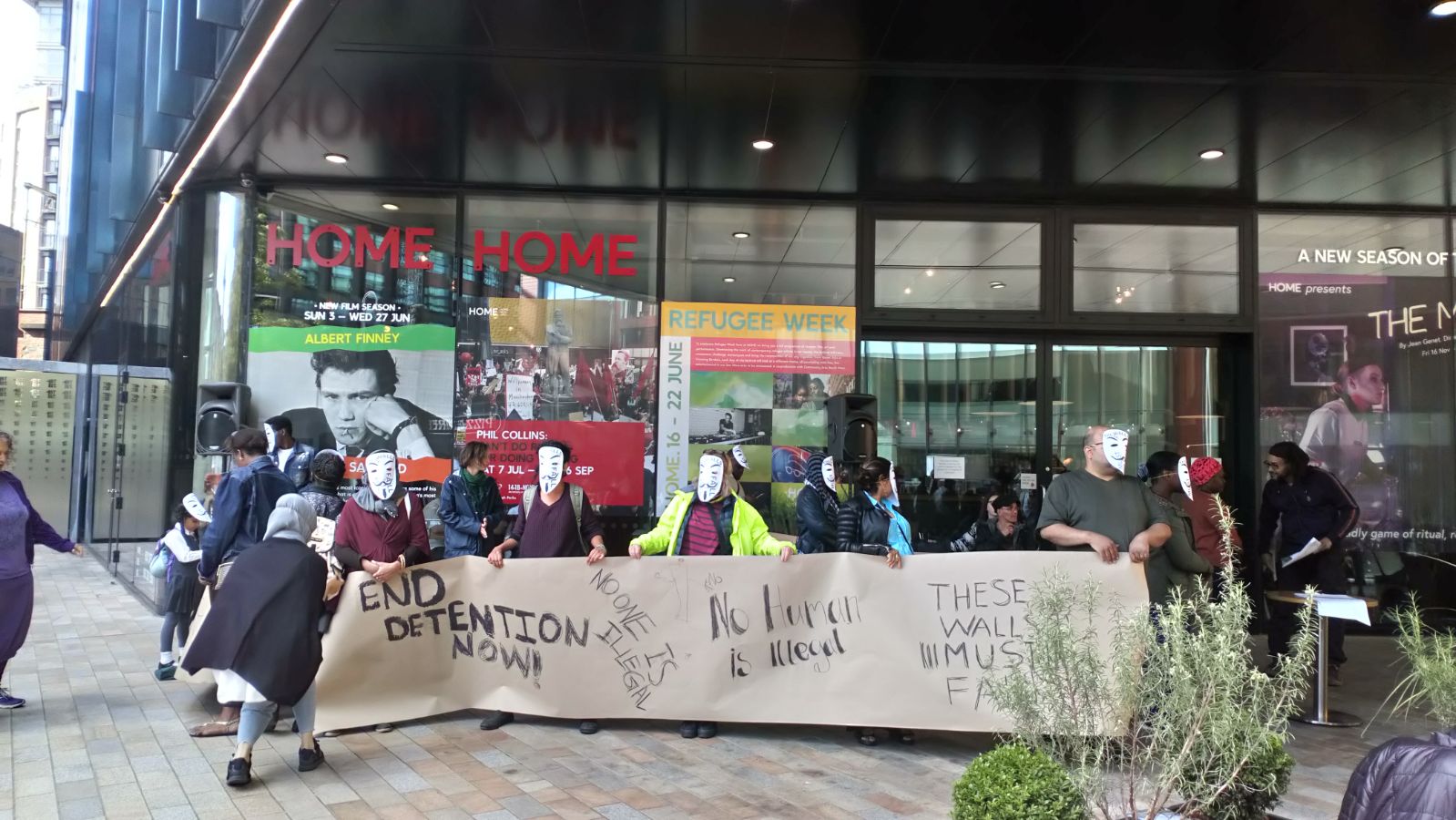 Campaigners with messages outside HOME