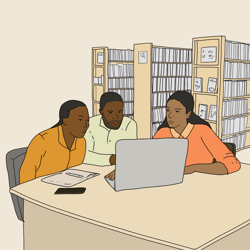 three people sitting together looking at a laptop. background is library shelves